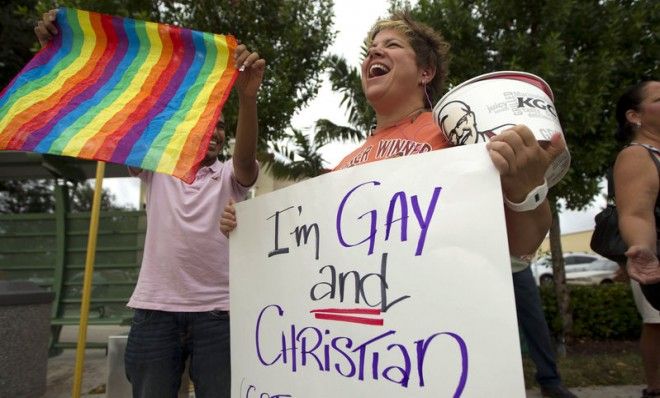 Carri Jo Anderson protests in front of a Chick-fil-A in Pompano Beach, Fla., in August 2012. The company&amp;#039;s Christian owners are against same-sex marriage.