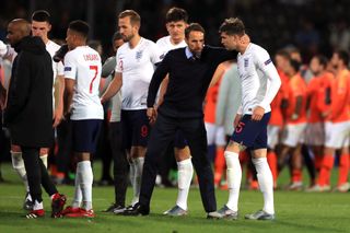 Gareth Southgate consoles his players