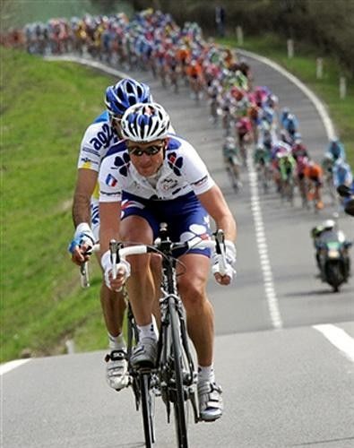 Finot and Arrieta getting caught by the peloton