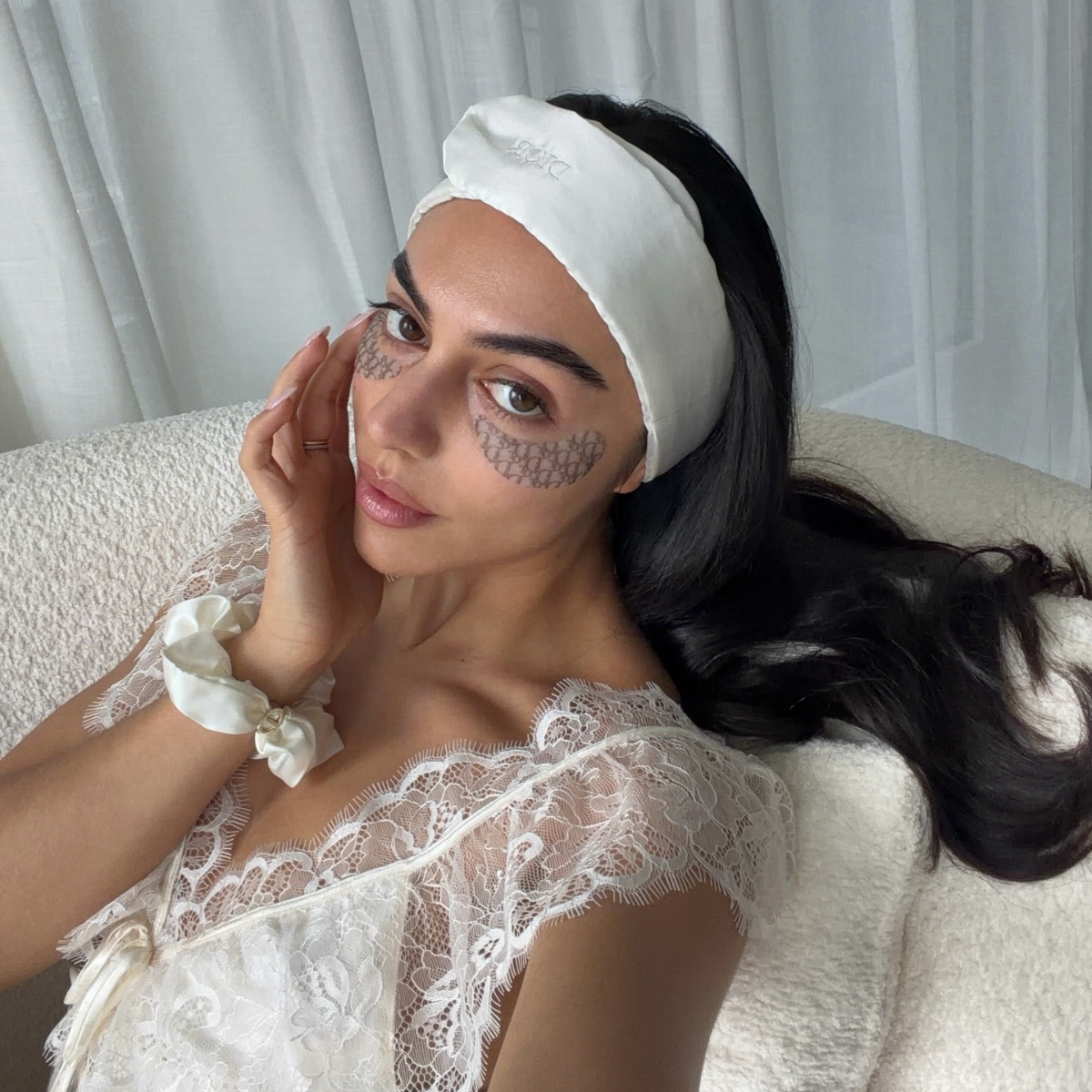 A woman with skincare eye patches