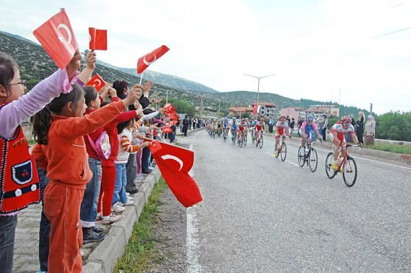 School children cheer for the Tour of Turkey peloton during stage four.