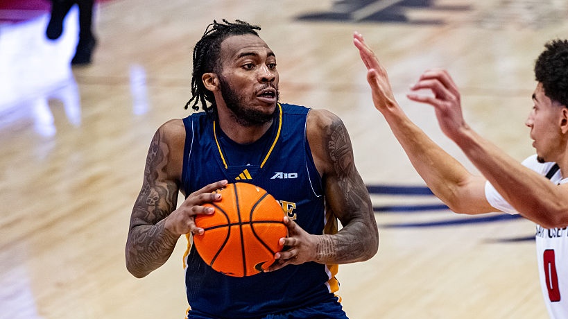 Rob Dockery (99) of the La Salle Explorers drives the ball while Derek Simpson (0) of the St. Joseph's Hawks defends during an NCAA men's basketball game at Hagan Arena in Philadelphia, United States, on March 7, 2026 (Photo by Dan Squicciarini/NurPhoto via Getty Images).