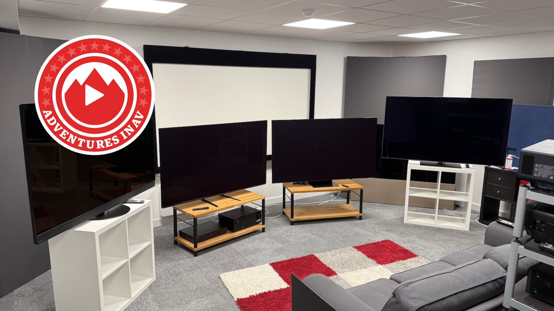 Flagship OLED TVs on stands with Adventures in AV logo
