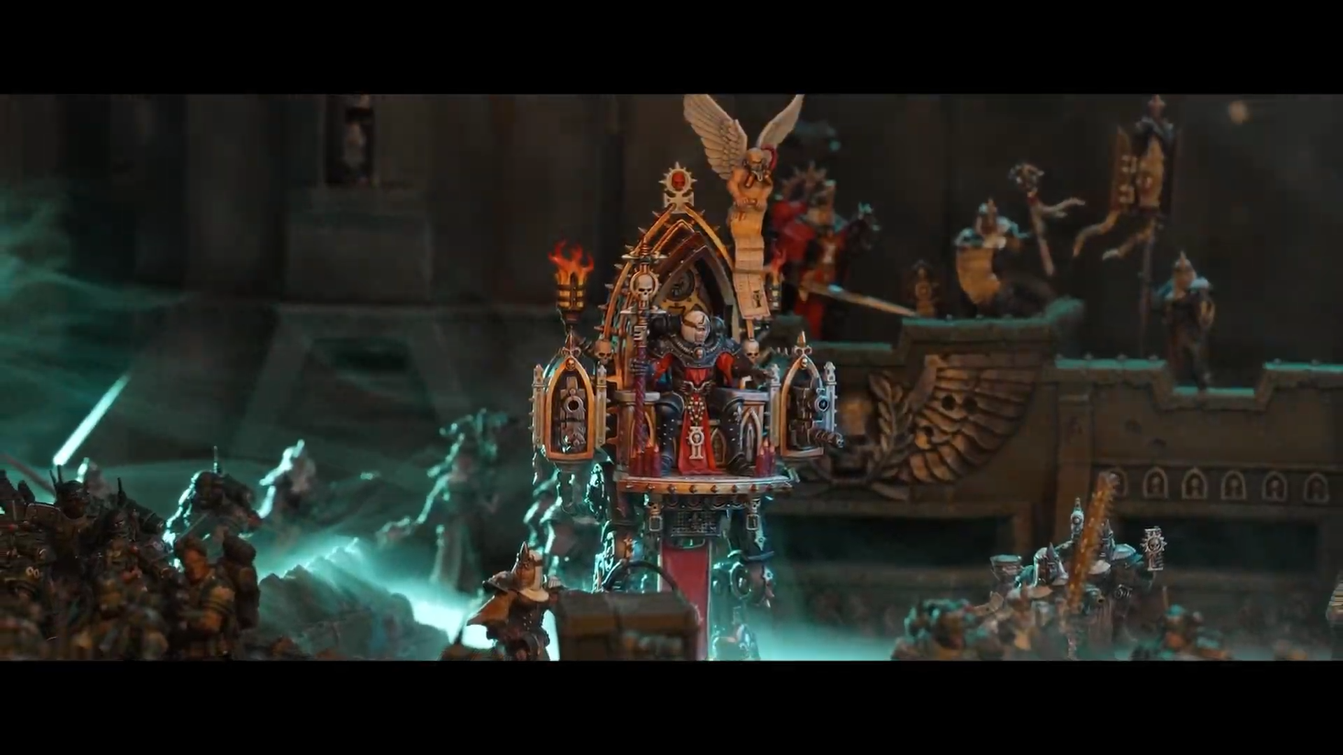 Warhammer miniatures posed against terrain and other models