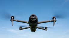 DJI Mavic 4 Pro in flight against a blue sky