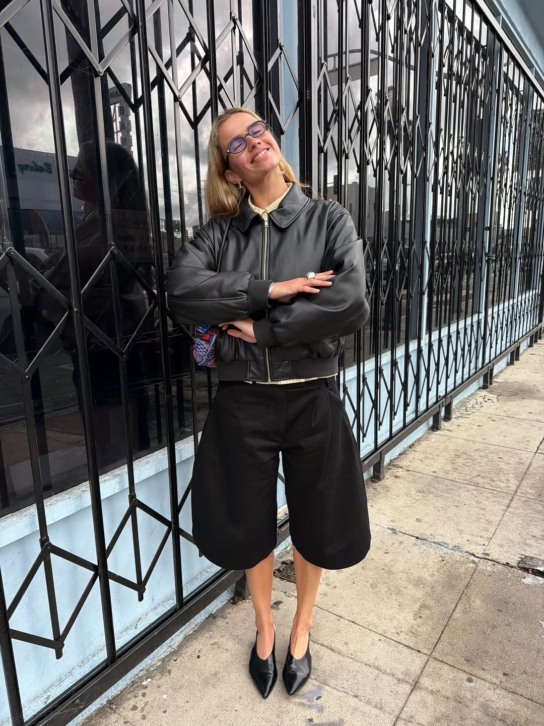 Influencer Tori Vanbreugel wearing culottes and a leather jacket.