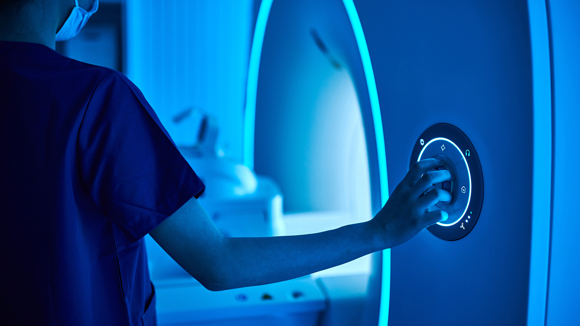 Close-up of one asian female nurse operating MRI scan machine in the MRI-scanner room