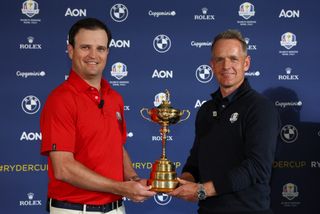 Photo of Luke Donald and Zach Johnson holding the Ryder Cup trophy