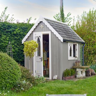 Exterior of grey pannelled shed in garden