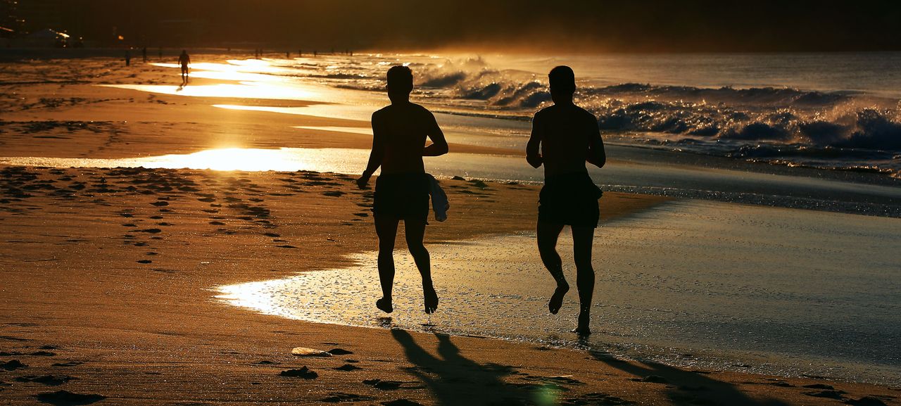 Joggers on beach