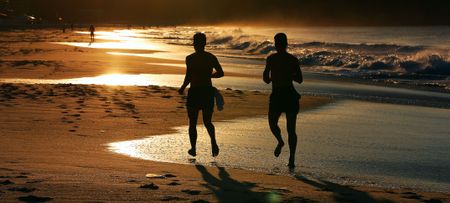 Joggers on beach