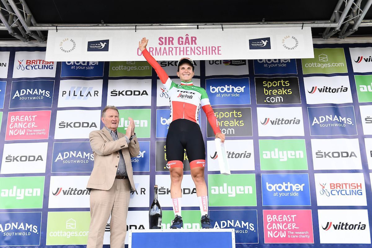 Picture by Simon Wilkinson/SWpix.com - 10/06/2022 - Cycling - The Women&acirc;s Tour 2022 - Stage Five - Pembrey Country Park to The Black Mountain, Wales - Elisa Longo Borghini of Team Trek Segafredo on the podium after her stage victory