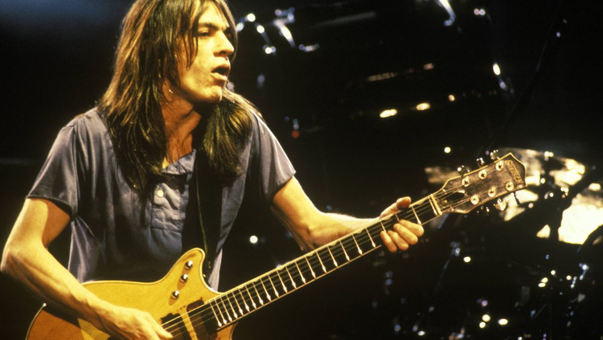 AC/DC&#039;s Malcolm Young performing live onstage, playing Gretsch 6131 Jet Firebird guitar 