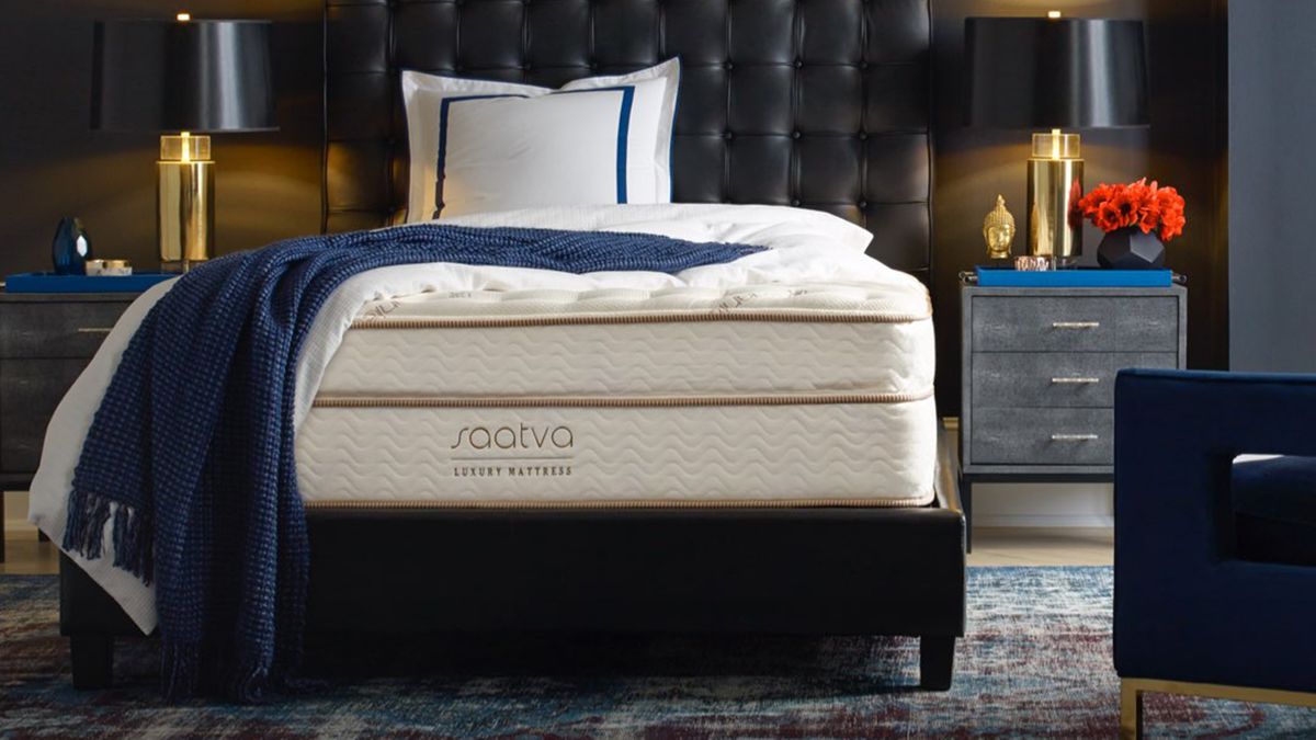 Saatva Classic Luxury Firm mattress on a black bed frame