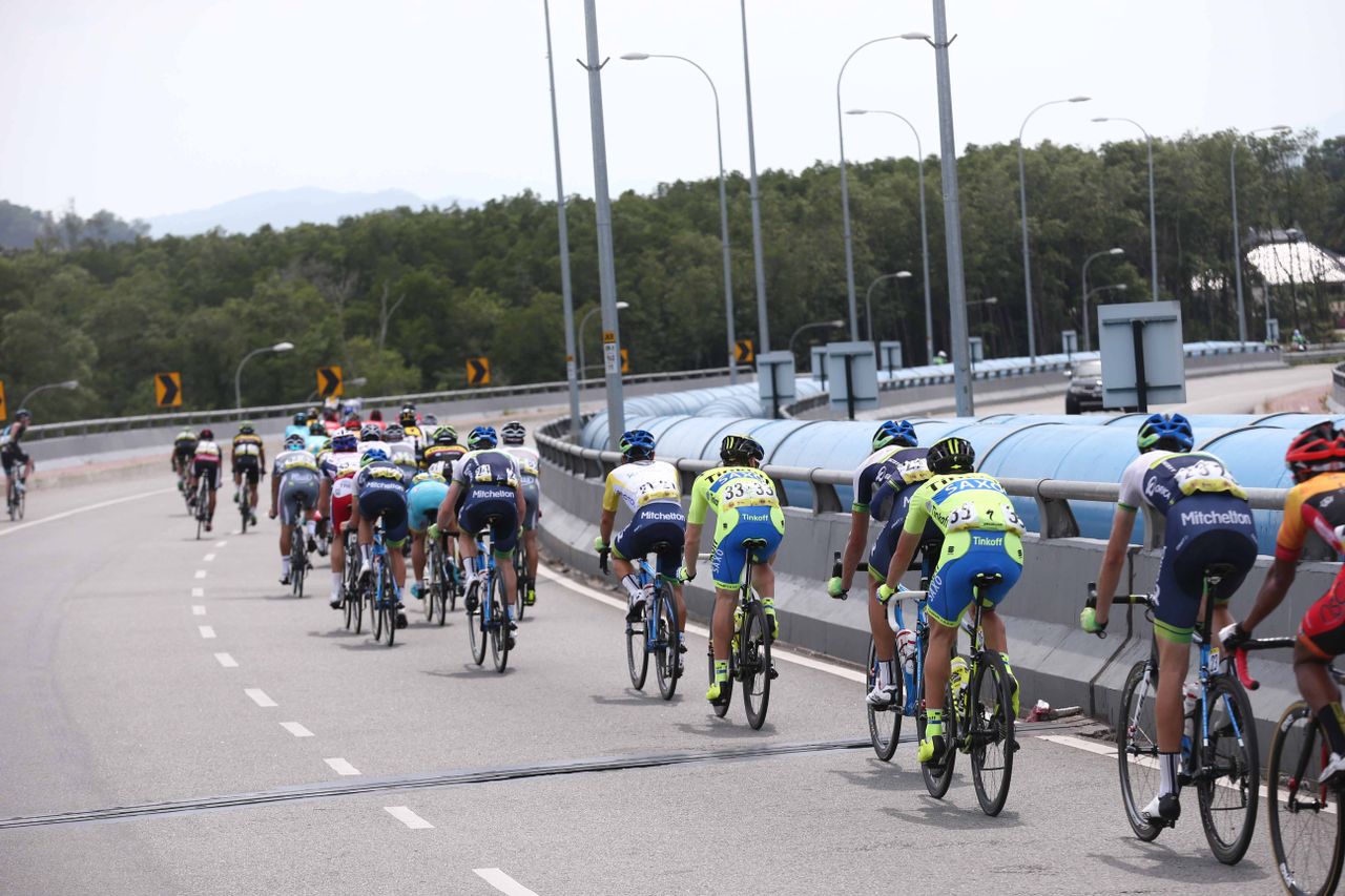Race leader Caleb Ewan sits in the back of the bunch