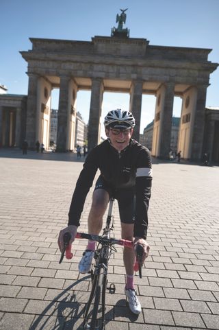 Mark Felstead on his bike in front of the Brandenburg Gate in Berlin
