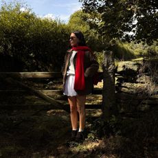 Jessica Skye wearing red scarf in the woods - best forest fruit perfumes