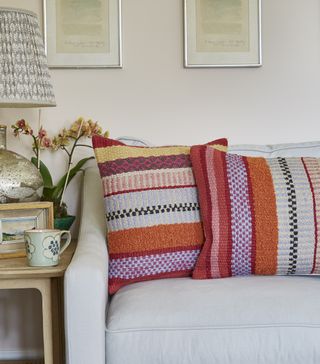 fall coloured cushions on neutral sofa in living room