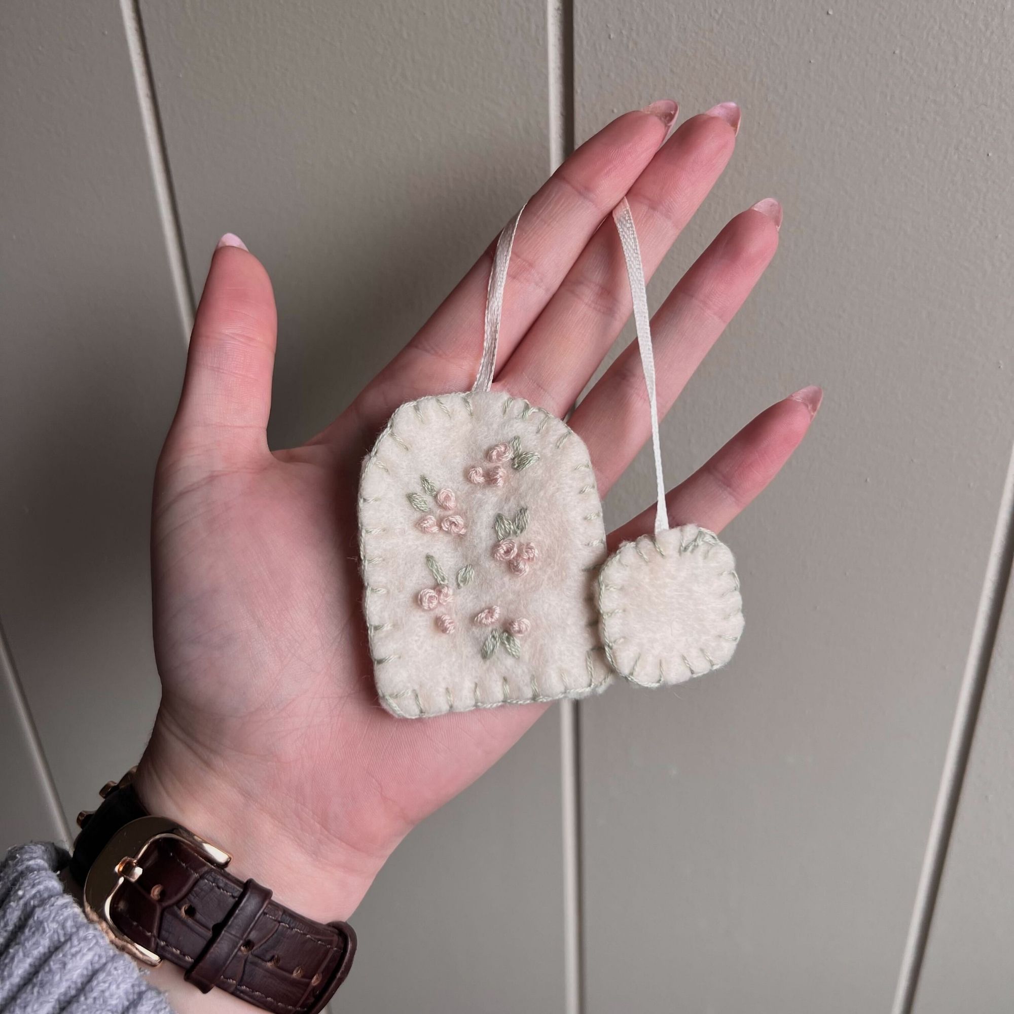 Layla Al-Ani holding the tea bag book mark she made.