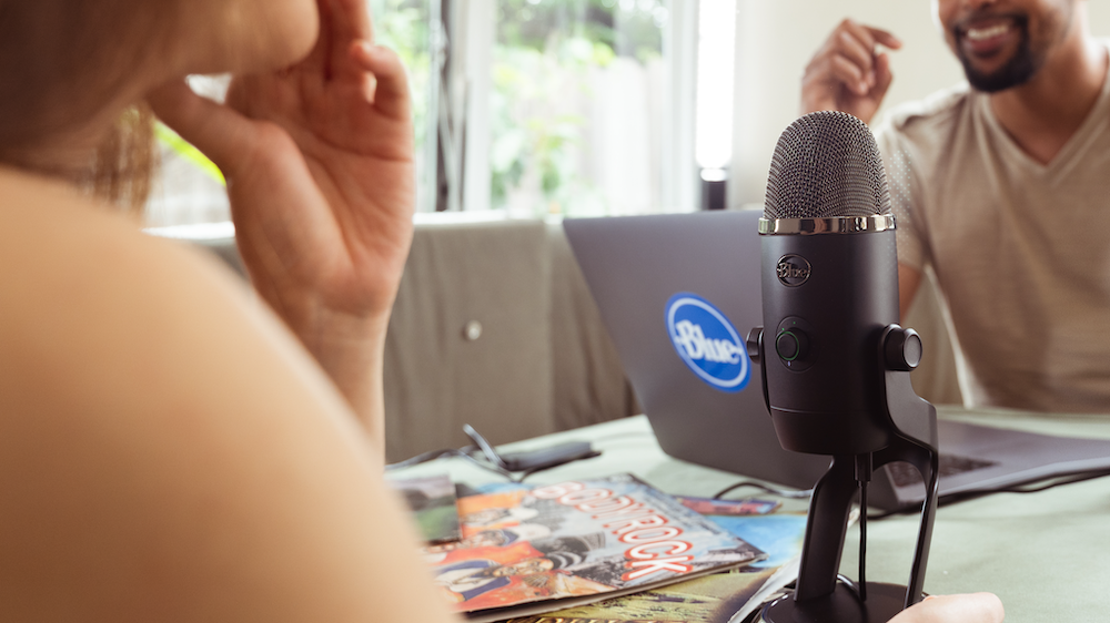 Podcaster using Blue Yeti microphone