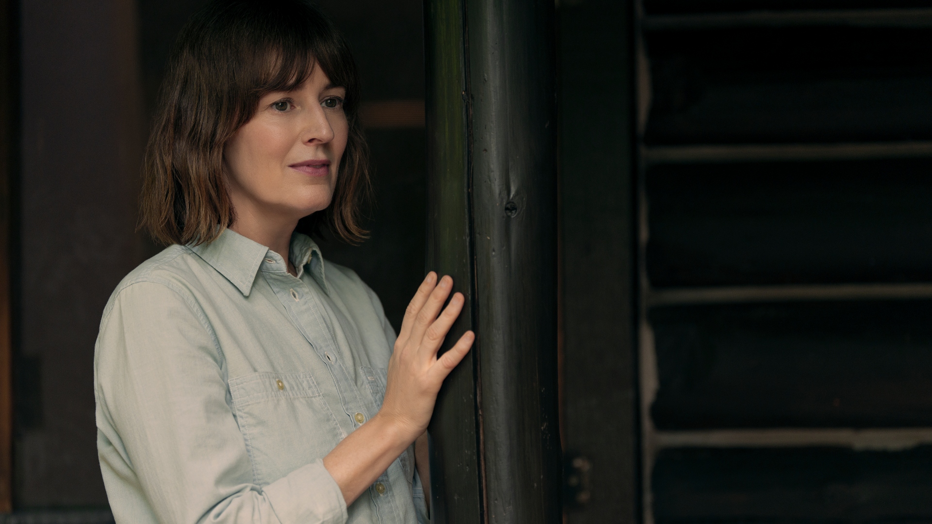 Jill stands by the door in Untamed