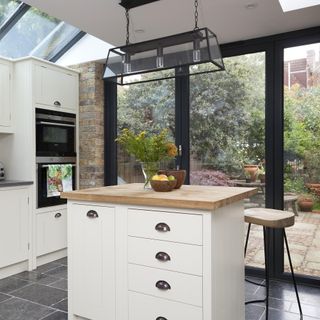 kitchen with island bifold doors to garden