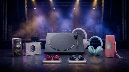 A selection of earbuds and headphones on AI-generated music-themed background