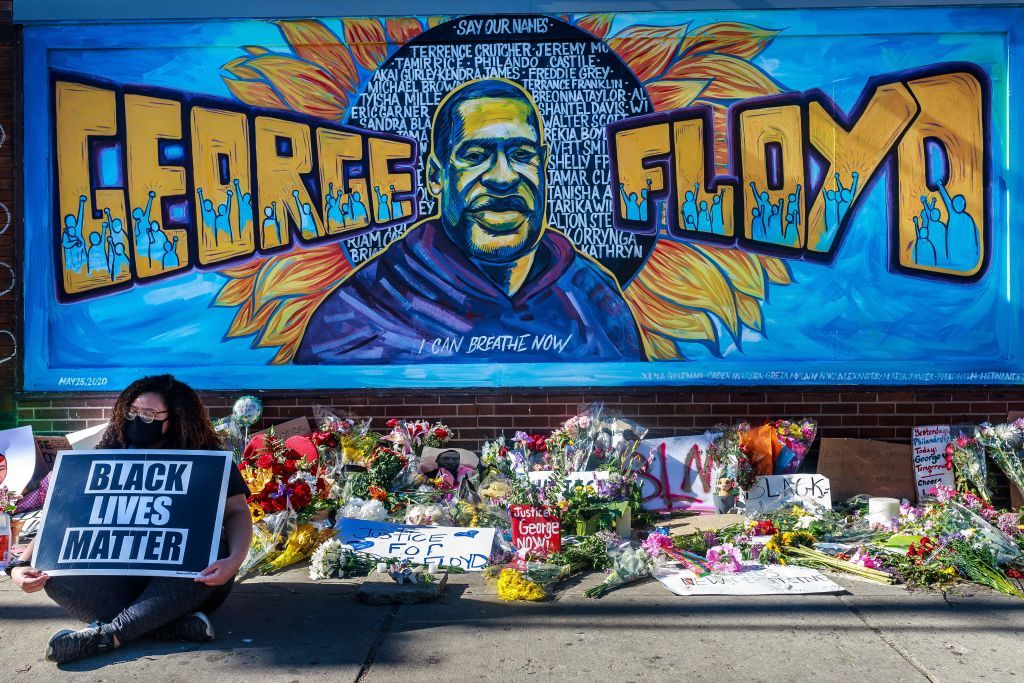 Flowers, signs and balloons are left near a makeshift memorial to George Floyd near the spot where he died while in custody of the Minneapolis police, on May 29, 2020 in Minneapolis, Minnesot