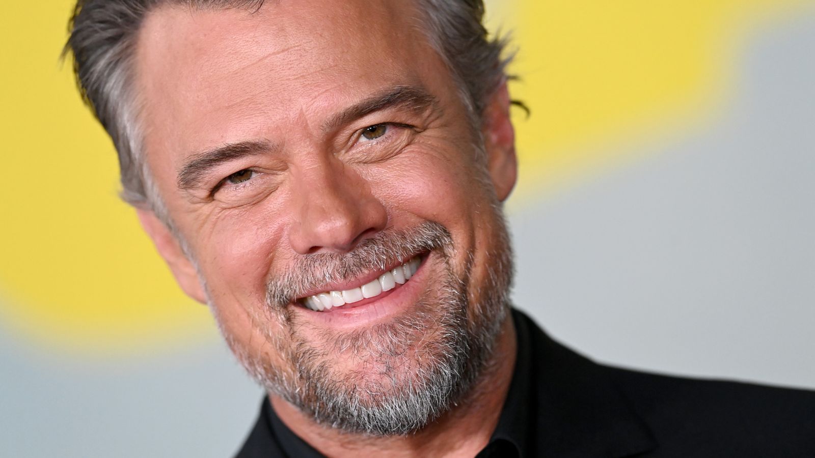 Josh Duhamel Brings His Poolside Patio to Life with Gray Furniture, Round Planters, and Beanbag Chairs – It's a Masterclass in Elegant, but Understated Outdoor Design