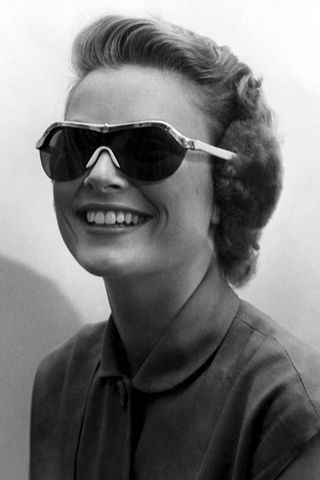 Grace Kelly wearing sunglasses and earmuffs