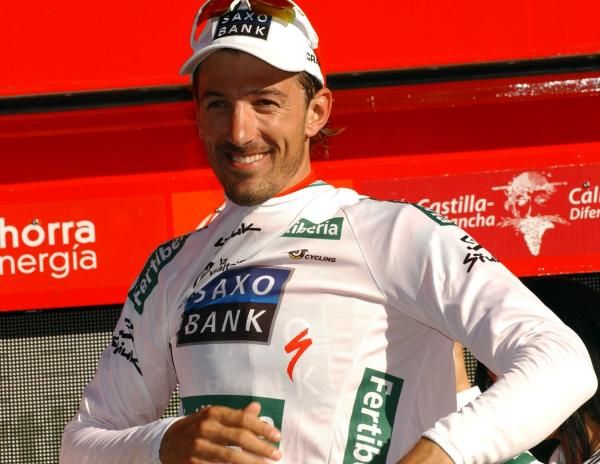 Cancellara puts on the white jersey of combination classification leader.