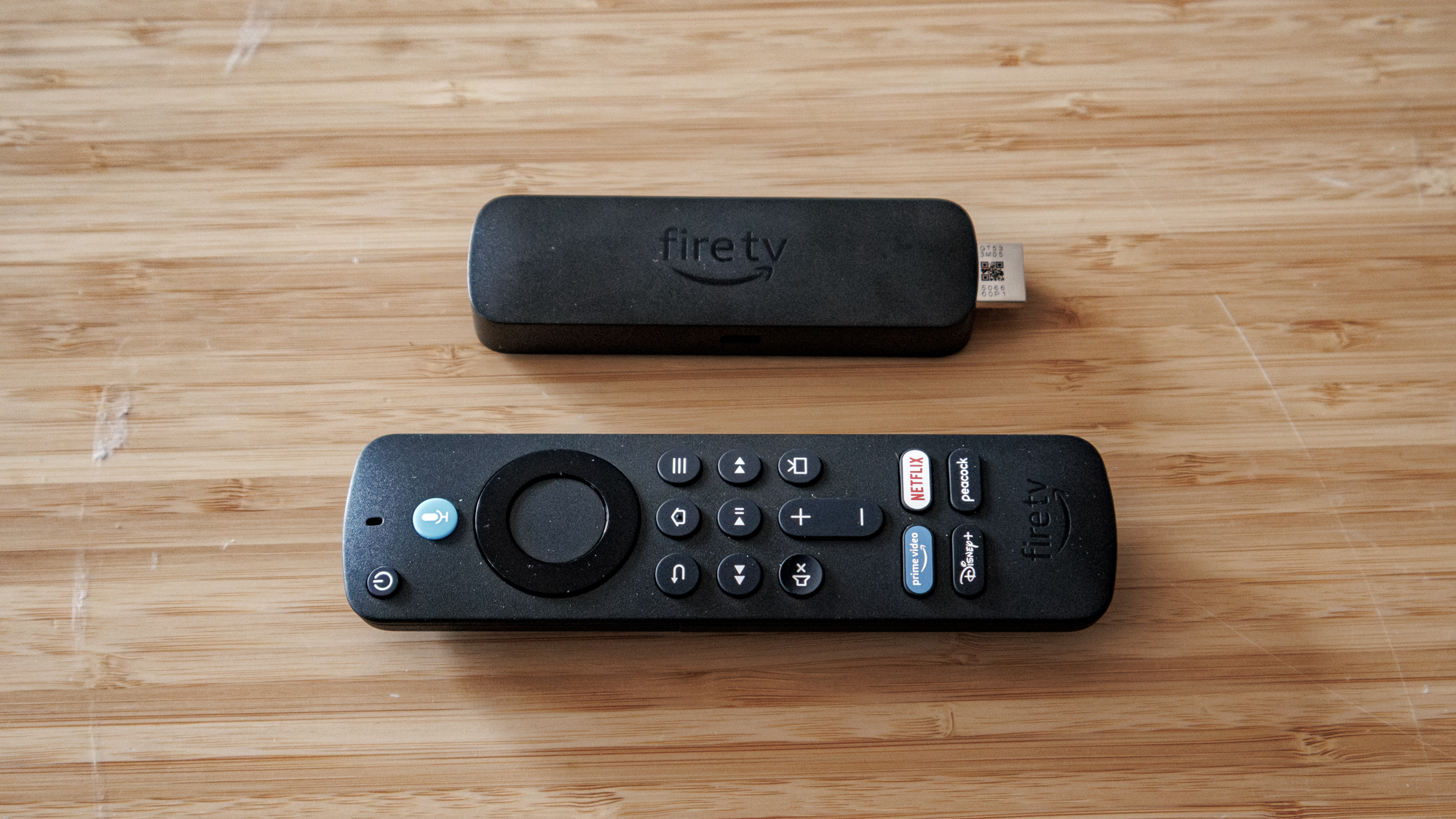 Amazon Fire TV Stick 4K Select and remote on a table