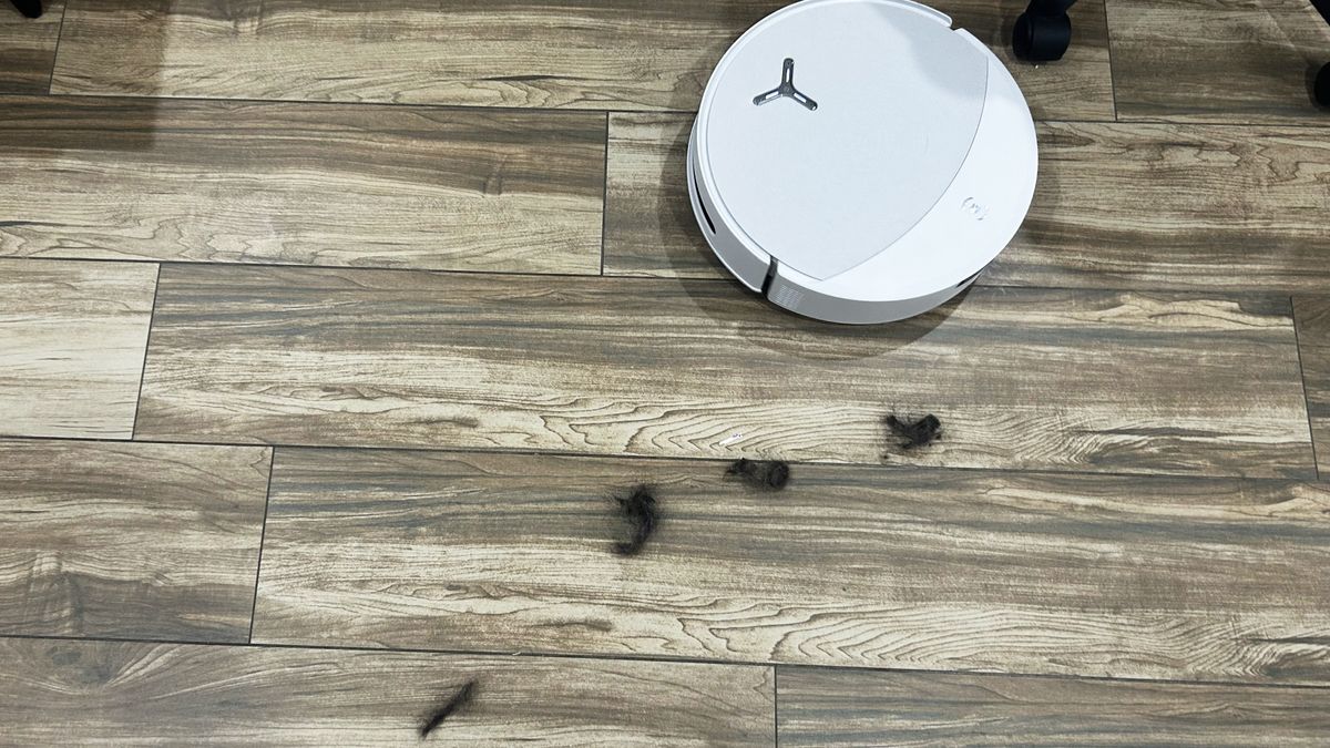 Ecovacs T90 Pro Omni with hair on hardwood floor