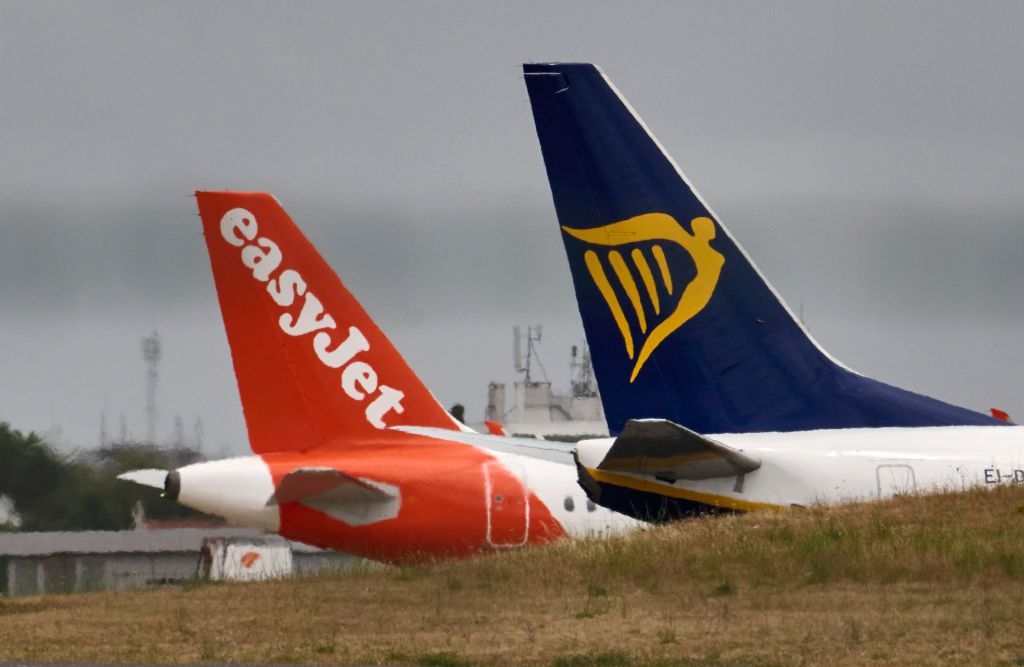 EasyJet and Ryanair aircraft sit on the tarmac in Humberto Delgado International Airport on June 03, 2022 in Lisbon, Portugal. 