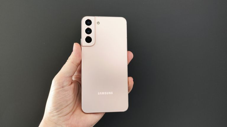 Samsung Galaxy S22 Plus in pink gold against dark background