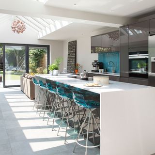kitchen with glass sliding doors and bar stools