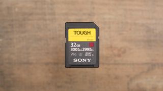 The Sony SF-G Series TOUGH UHS-II, one of the best SD cards, on a wooden surface