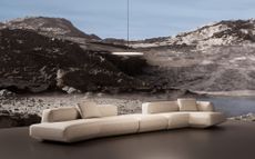 Flexform Loungescape modula sofa set in rugged scenery, with a pendant lamp above