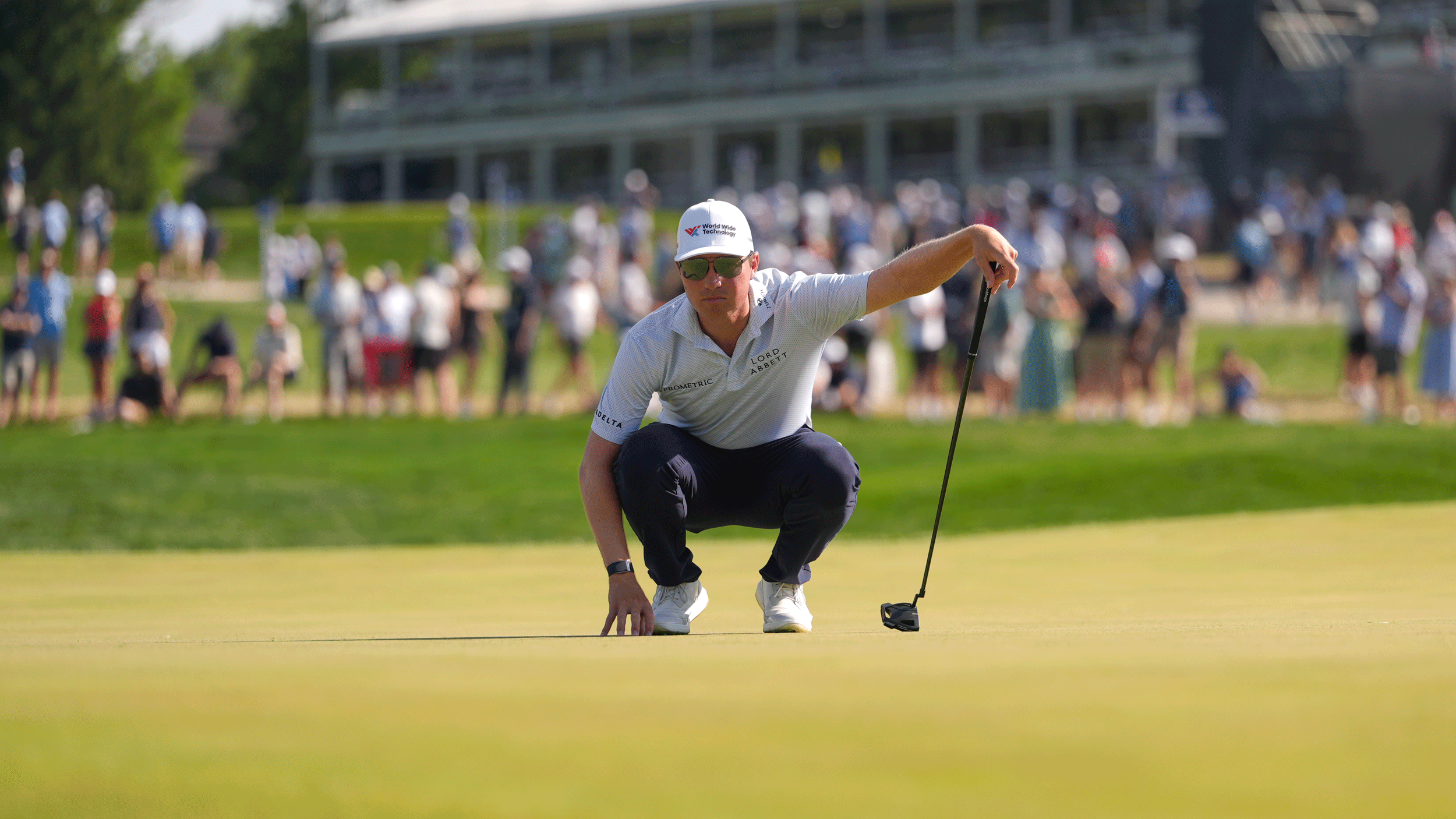 Ben Griffin crouches down behind a putt during the final round of the 2026 PGA Championship