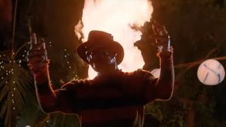 Robert Englund with a roaring fire behind him in A Nightmare on Elm Street 2: Freddy's Revenge