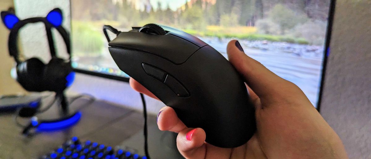 The Razer DeathAdder V3 in hand, seen from the top and side.