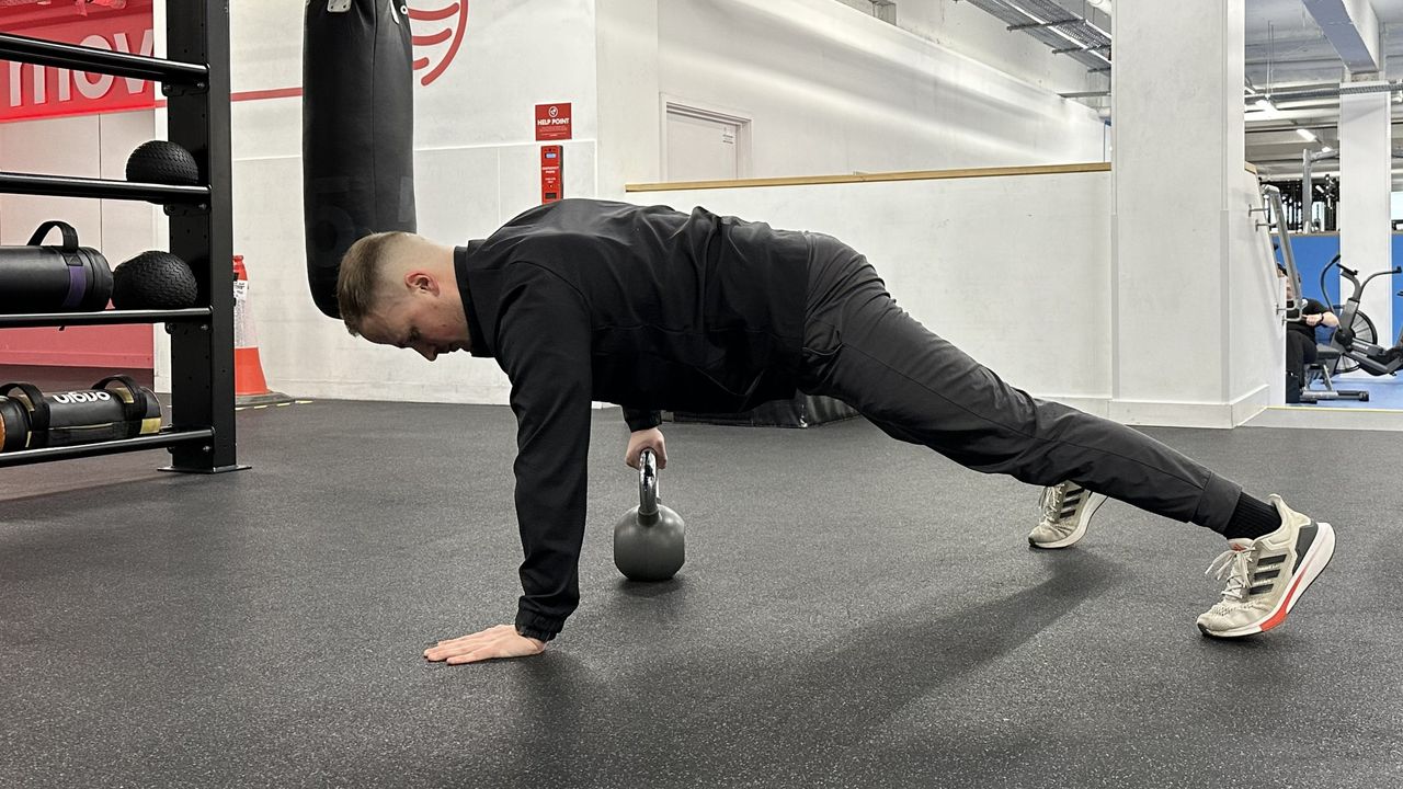 Ollie Thompson performing a kettlebell drag through