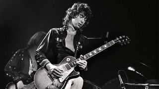 Jimmy Page performing on stage at the Seattle Coliseum 