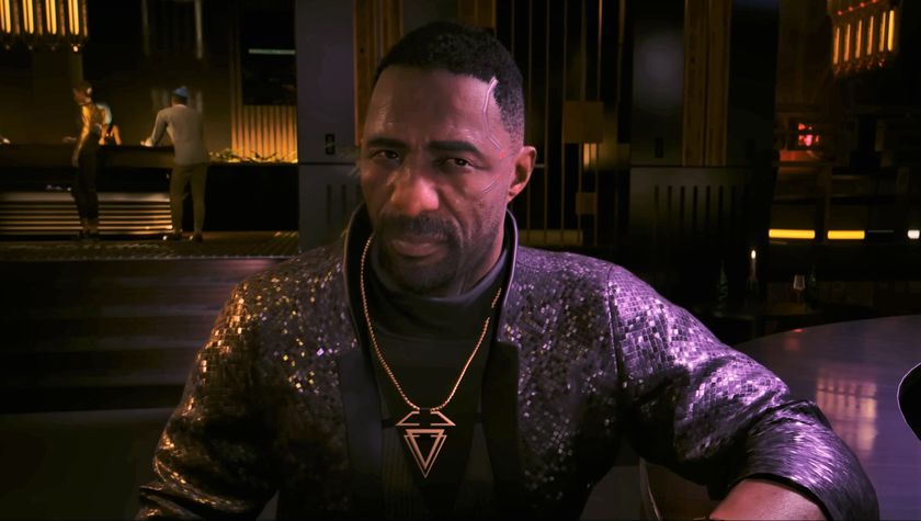 Idris Elba in Phantom Liberty looking at camera while seated at upscale restaurant