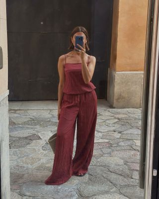 Woman wearing a summery burgundy matching set