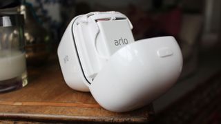 The Arlo Go with its back panel open, microSD and SIM card slots