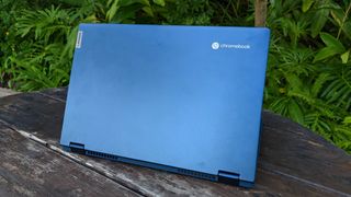 Lenovo Chromebook Flex 5i sitting on a bench