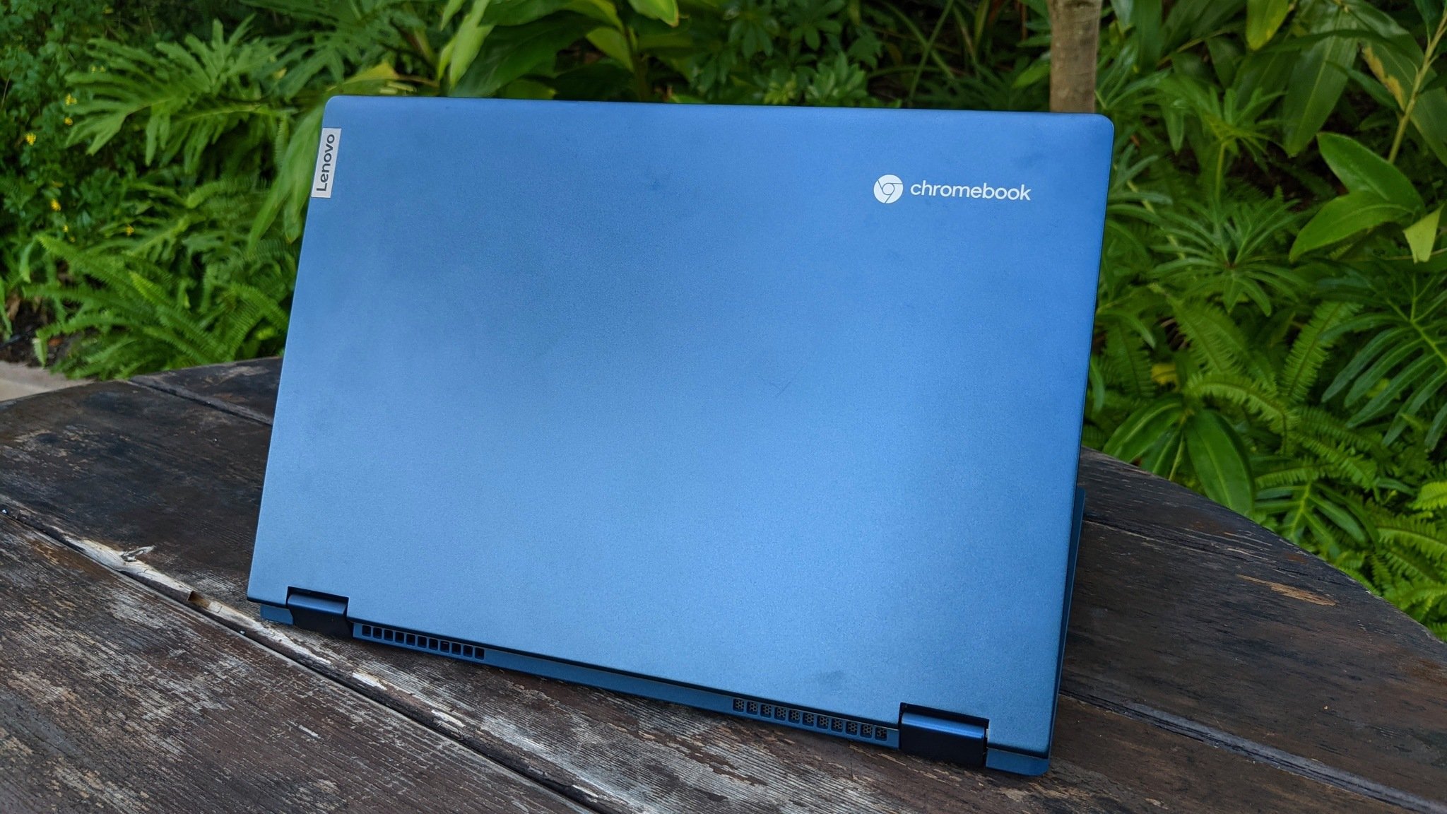 Lenovo Chromebook Flex 5i sitting on a bench