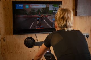 Image shows a person riding indoors.