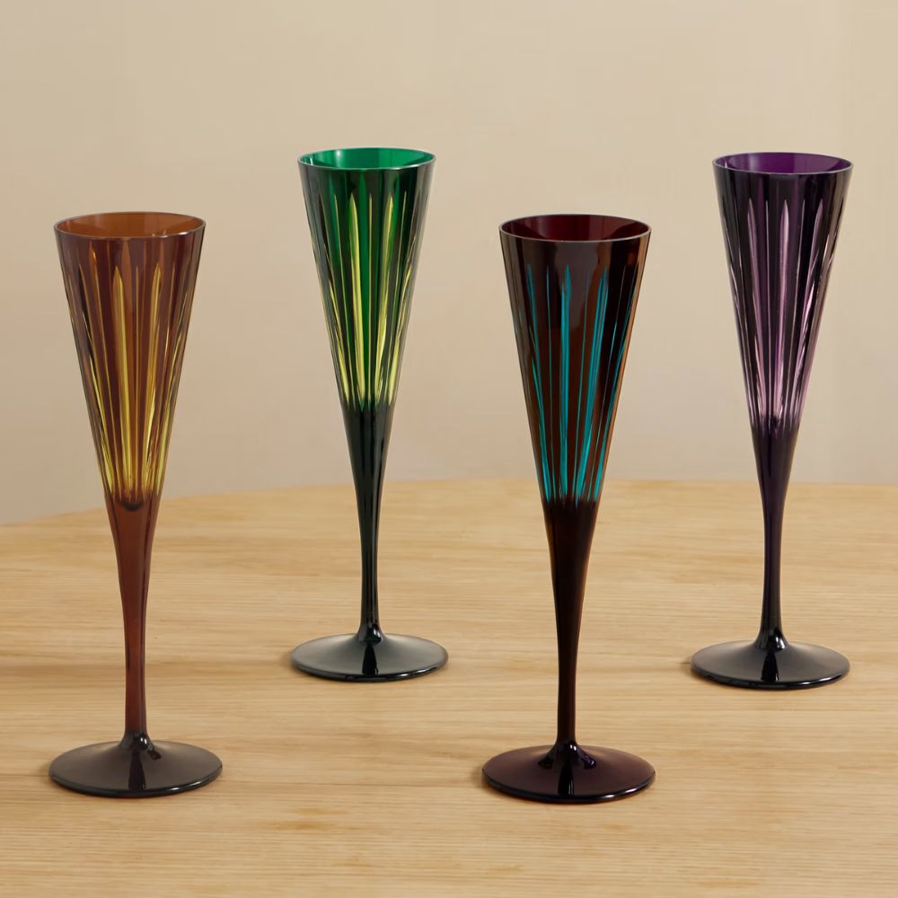 four colorful champagne flutes